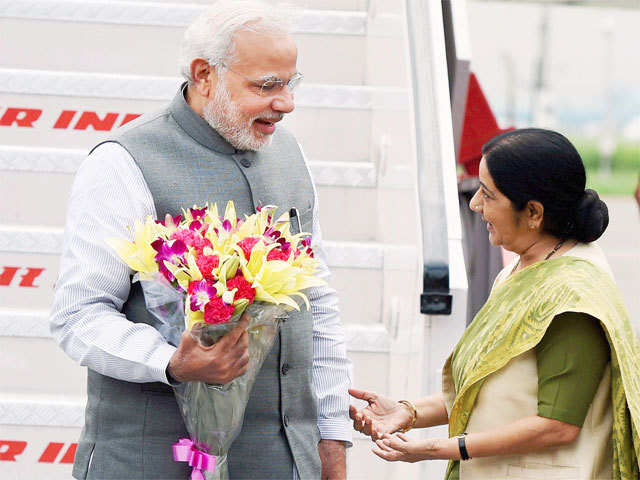 PM Narendra Modi being welcomed by Sushma Swaraj