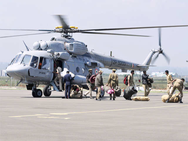Rescue team boarding a Indian air force helicopter