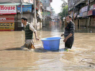 People walks through flood water