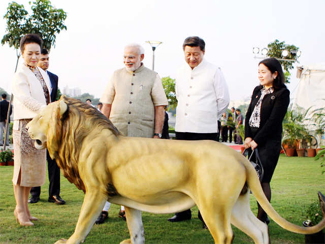 Admiring a lion statue