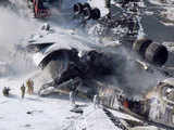 Emergency workers next to crashed cargo plane