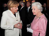 Queen Elizabeth speaks with German Chancellor Merkel