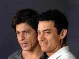 The Khans pose for photographers