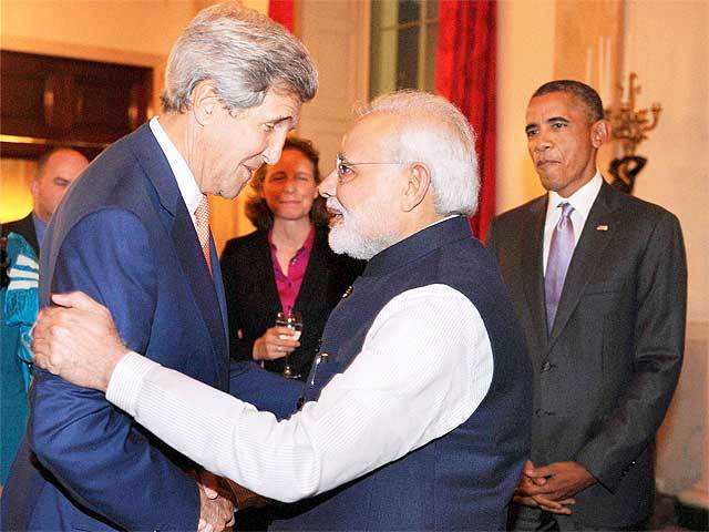 PM Narendra Modi greets John Kerry