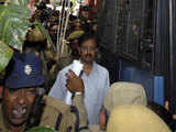 Ramalinga Raju is escorted from a court in Hyderabad 