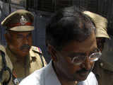 Ramalinga Raju is escorted from a court in Hyderabad 