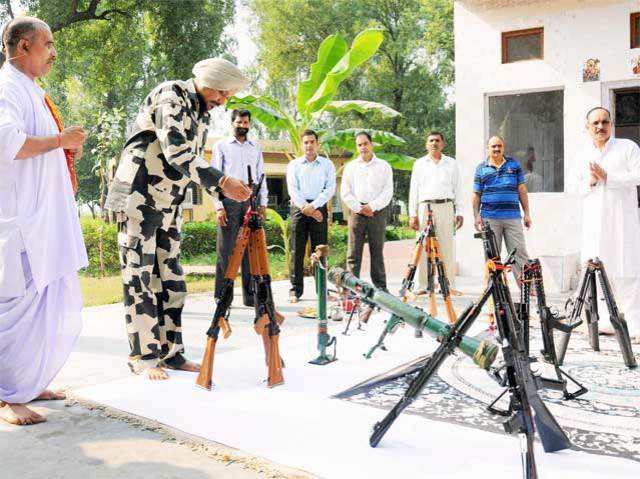 BSF officers and jawans worship their weapons