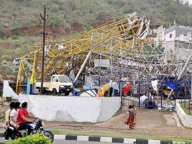 People watch damage to a property