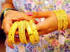 Gold glitters on Dhanteras buying, global cues