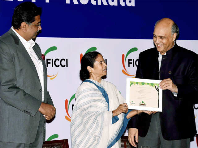 FICCI President hands over a green certificate to Mamata Banerjee