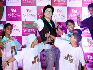 Bollywood actor Shahrukh Khan dances with kids in Mumbai