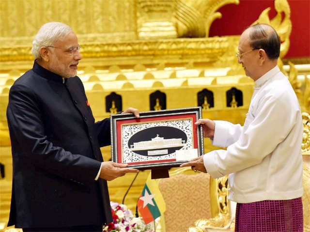 PM Modi receives a memento from President of Myanmar