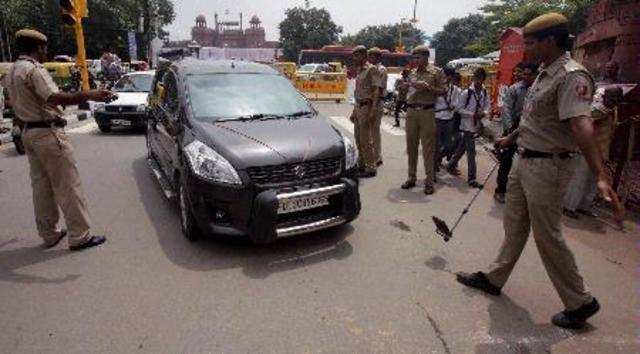 New Delhi: Police personnel checking vehicles near the historic Red Fort on the ...