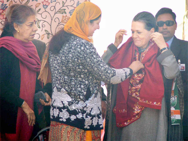 Sonia Gandhi being presented a pheran