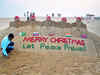 World's top leaders on sand with message 'Let Peace Prevail'