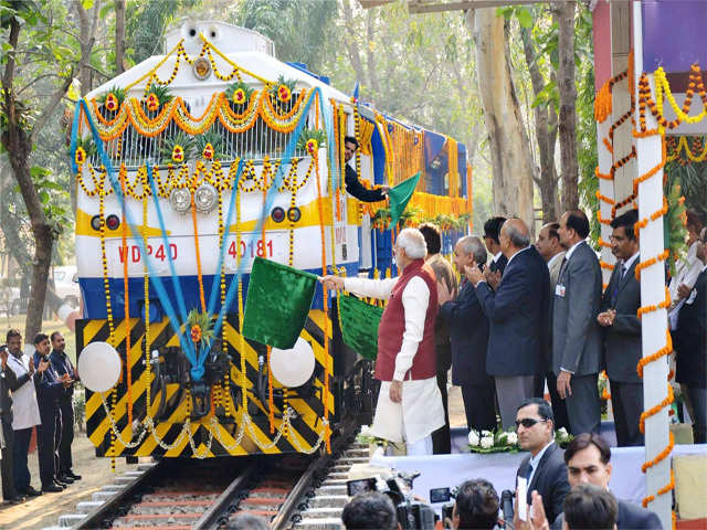 PM Modi flagging off the new high horsepower diesel locomotive