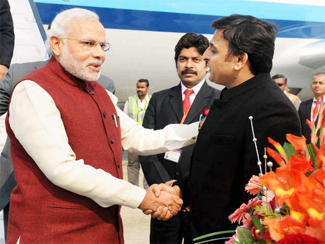 Akhilesh Yadav receives PM Modi at Varanasi airport