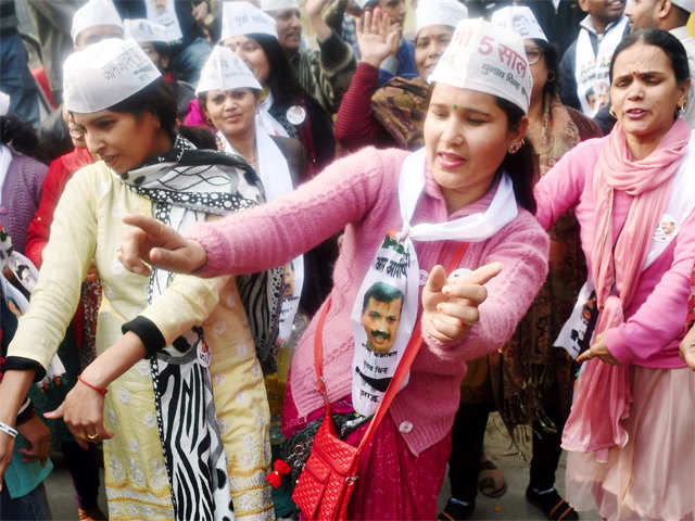 Supporters of AAP leader dance during his nomination filing procession