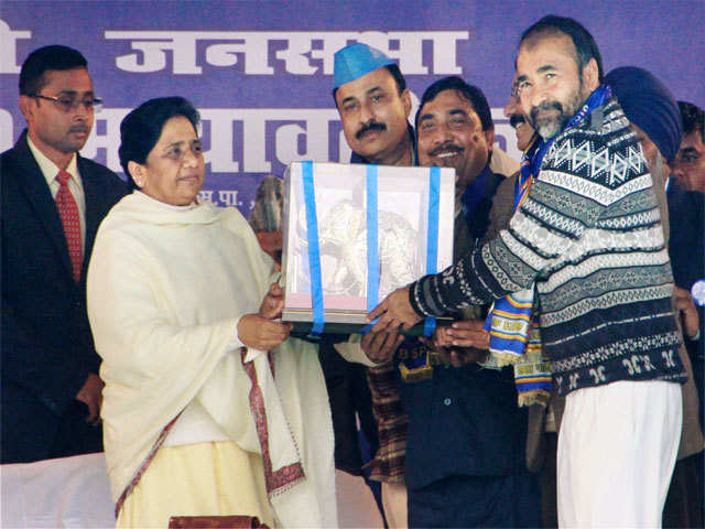 Mayawati being presented a memento