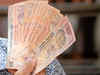 Rupee edges up two paise in volatile trade