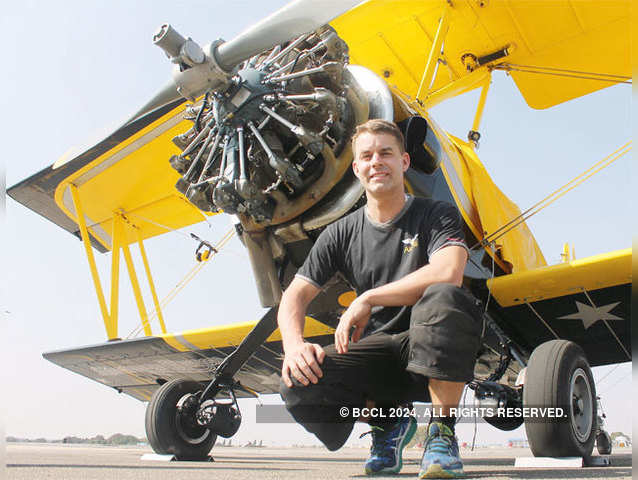 Pilot Jacob Hollander pose with GRUMMAN G-164A Ag-Cat