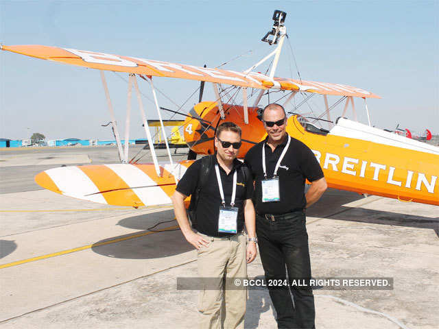 Pilots strike pose infront Breitling Wingwalkers