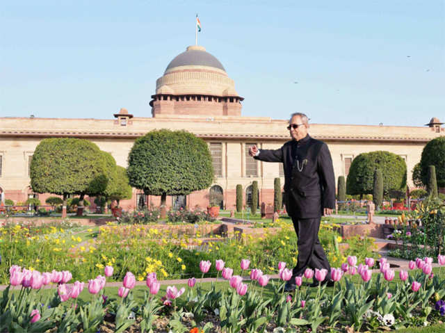 President Pranab Mukherjee walks at the Mughal Gardens