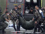 Brazilian Air Force carry the body of a victim