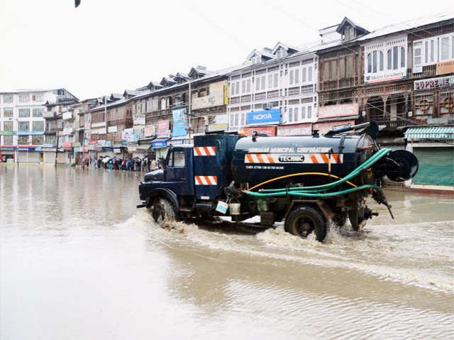 Vehicle passes through waterlogged road