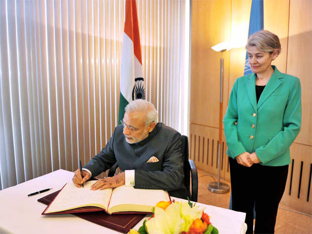 PM Modi signing the visitor’s book