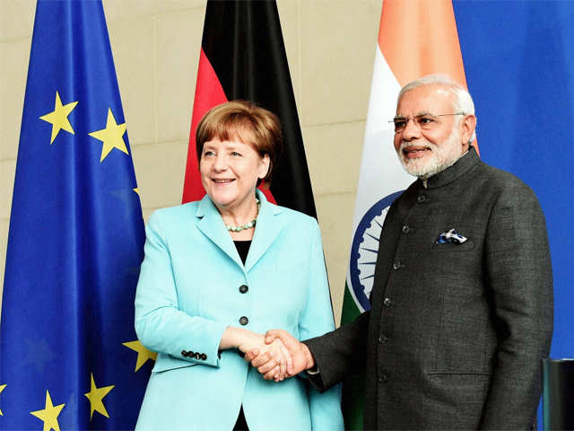 PM Modi shakes hands with German Chancellor