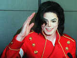 Michael Jackson waves to photographers