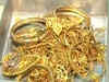 Gold, silver end lower on global cues, subdued demand
