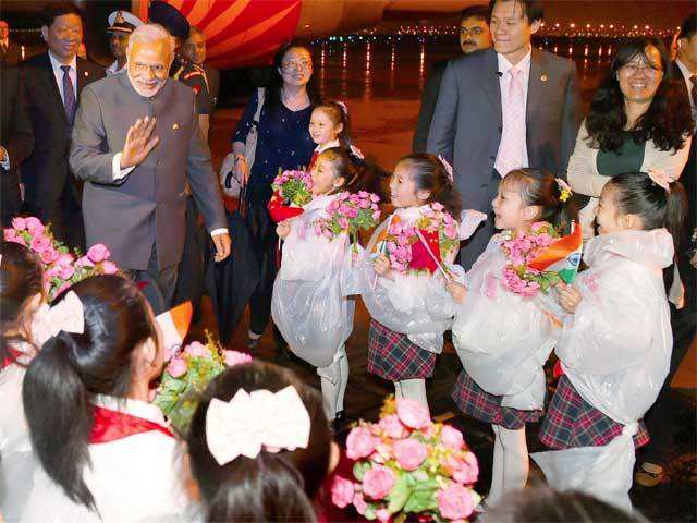 PM Modi welcomed by children in Shanghai