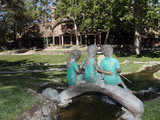 Bronze statue of three children fishing