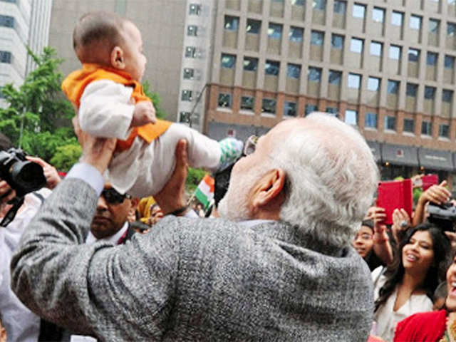 PM Modi plays with a child