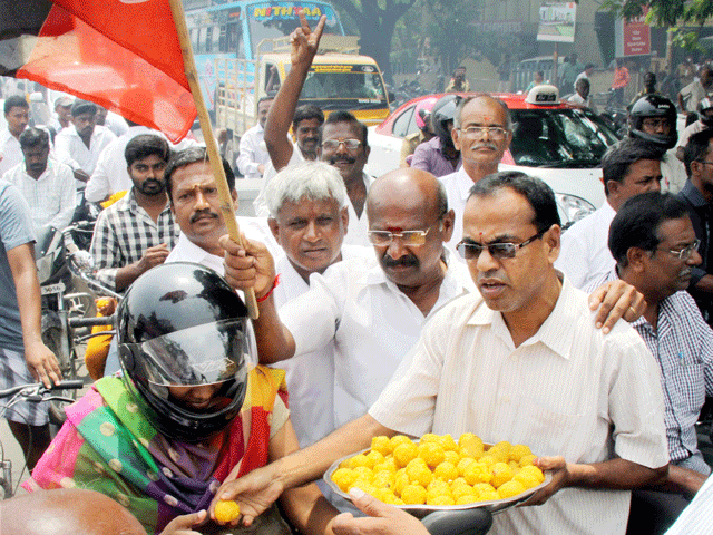 Fans distribute sweets near Poes Garden