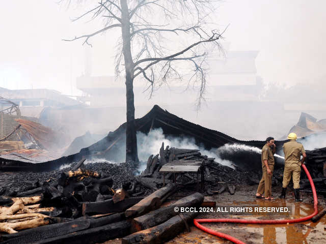 Fire brigade personnel trying to dose off fire