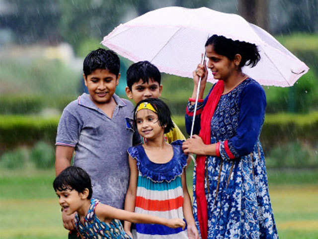 Children enjoy monsoon shower