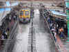 Mumbai back to work, train services restored