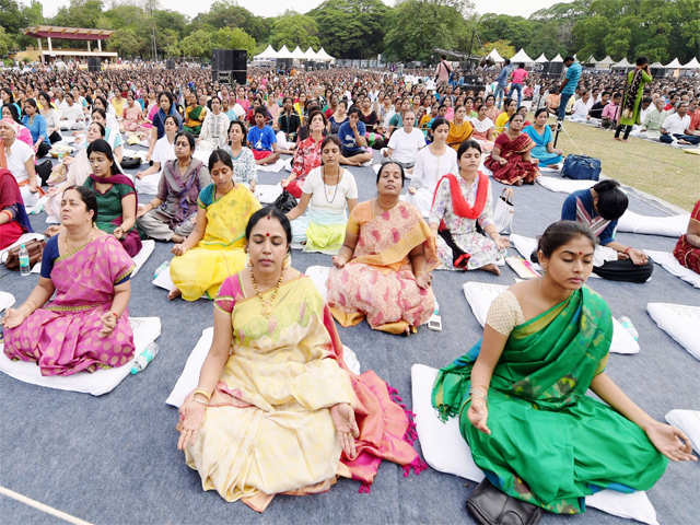 Women in Chennai perform Yoga
