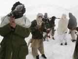 Taliban militants with their weapons