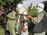 Taliban fighters with weapons