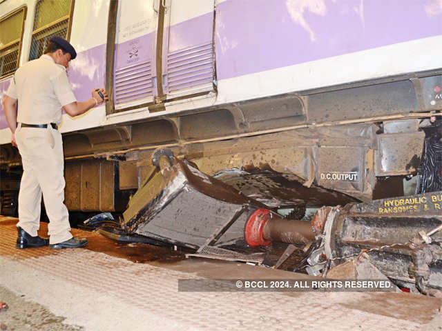 Mangled coach removed from the track