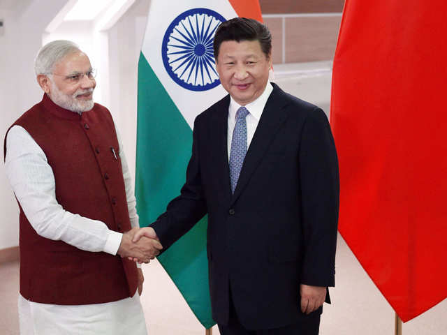 With Chinese counterpart Xi Jinping