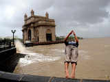 A reveller at the Gateway of India back flips