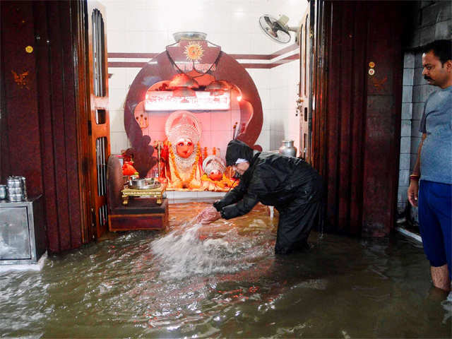 People remove water from a temple