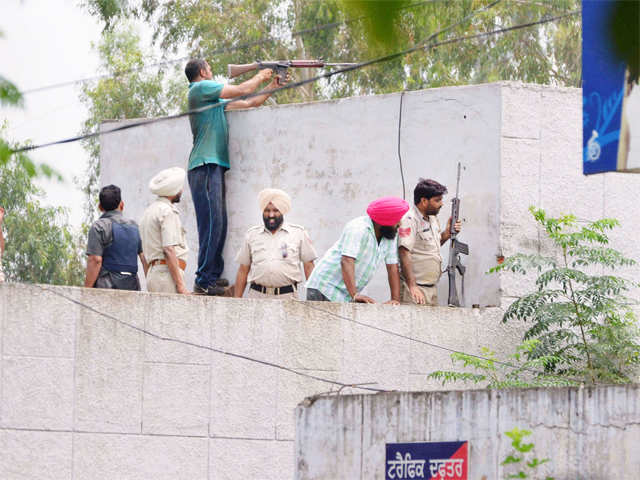 Police personnel during an encounter with the militants