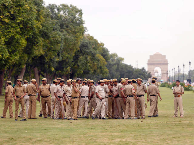 Police officers gather for a briefing