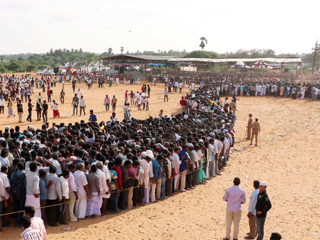 People waiting in a long queue